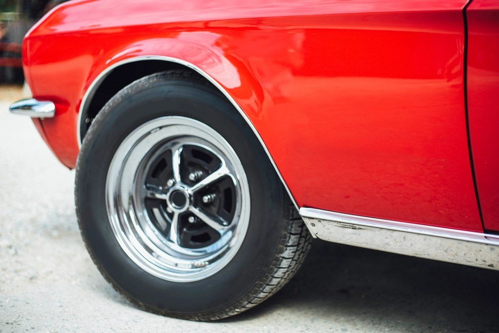 Glossy red car fender and wheel